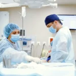 A diverse group of doctors discussing patient care in a hospital setting, symbolizing the evolving landscape of doctor jobs in the U.S., including telemedicine, salaries, and work-life balance.