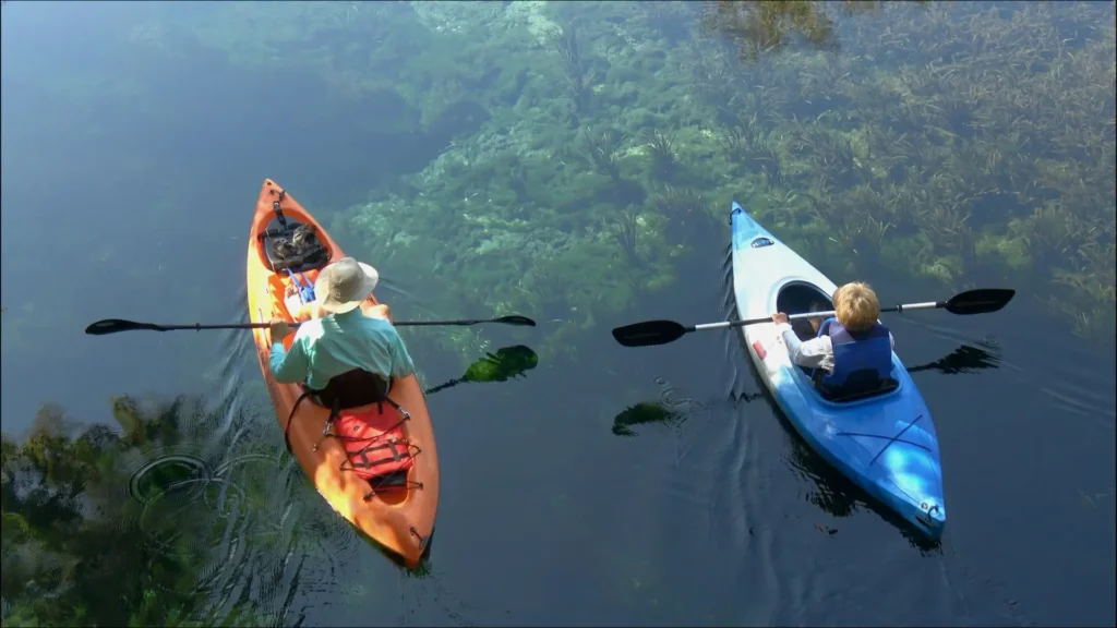 Kayaking in Winthrop WA on the Methow River with scenic North Cascades mountain views and calm waters.